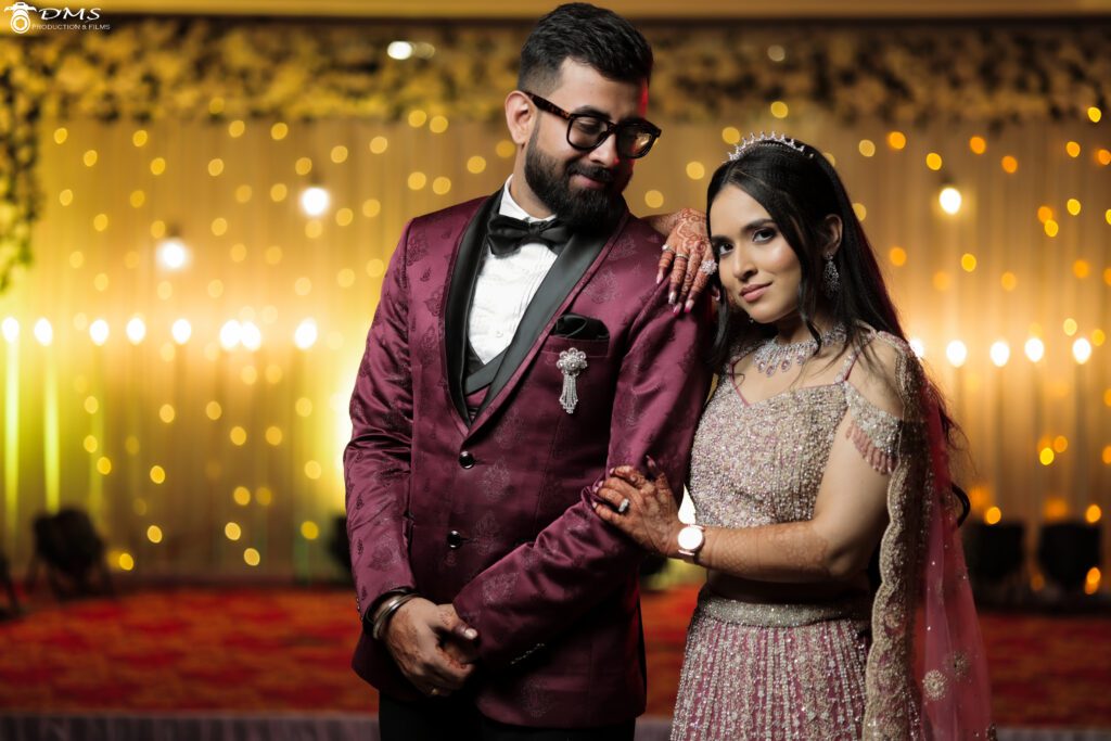 A wedding couple standing together and groom looking at the bride with a smile