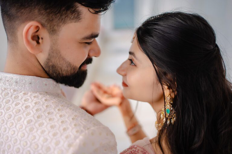 a close up shot from back of bride and groom looking at each other