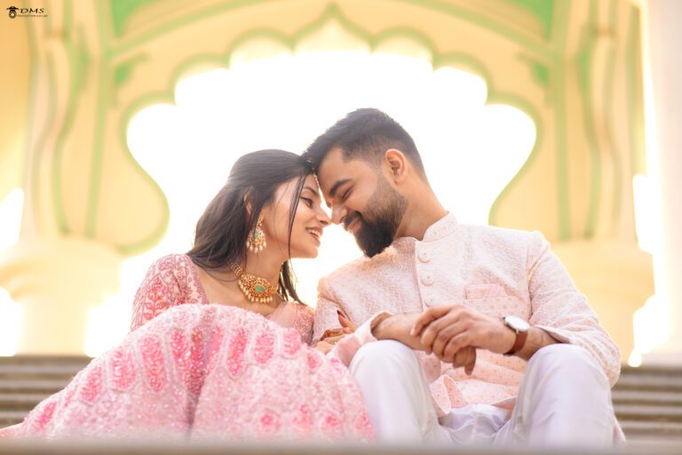 A pre wedding photography of couple in Bhubaneswar sitting together and their head touches each other head