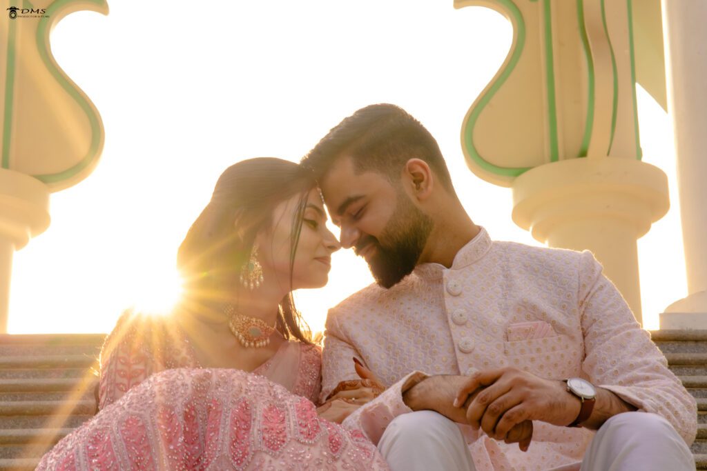 A pre wedding photography of couple in Bhubaneswar sitting together and their head touches each other head