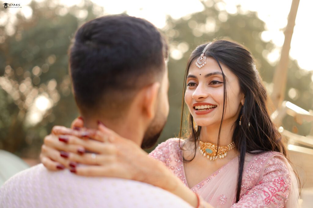 wedding Bride holding the groom with hands and looking at his face with a great smile