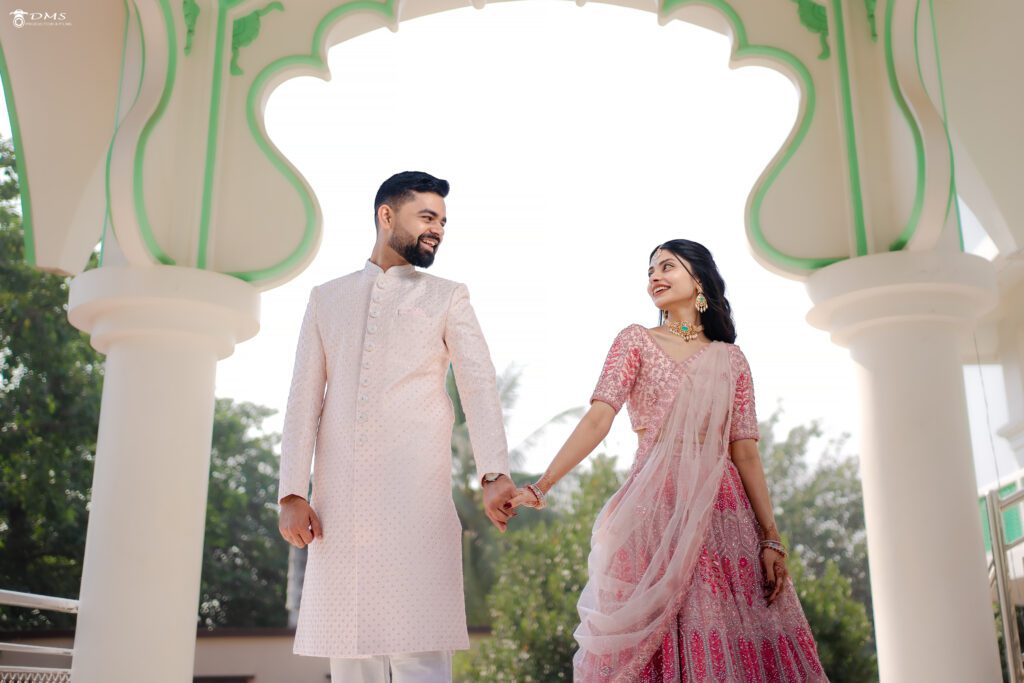 Engagement photography in Bhubaneswar of couple holding their hands looking at each other with smile